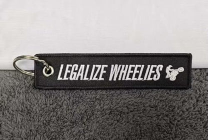 PrimeSecrets Keychains for Motorcycle, Scooter, Car, Mopes, ATV, Backpack Gift Men Women Street Racing Auto Parts Accessories - color: Legalize Wheelies