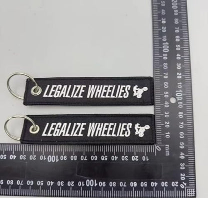 PrimeSecrets Keychains for Motorcycle, Scooter, Car, Mopes, ATV, Backpack Gift Men Women Street Racing Auto Parts Accessories - color: Legalize Wheelies